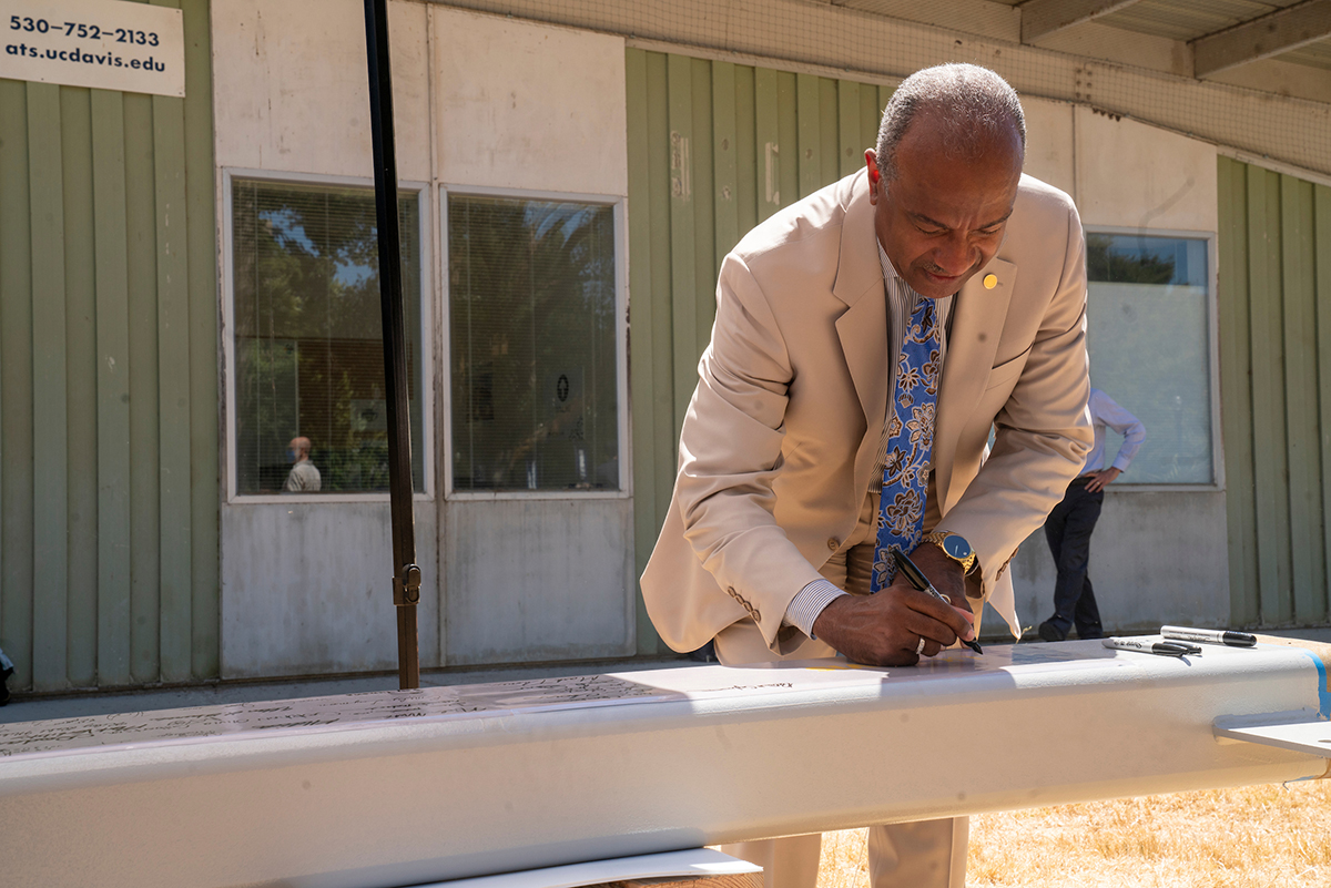 Image of UC Davis Chancellor May signing the TLC Topping-off beam.