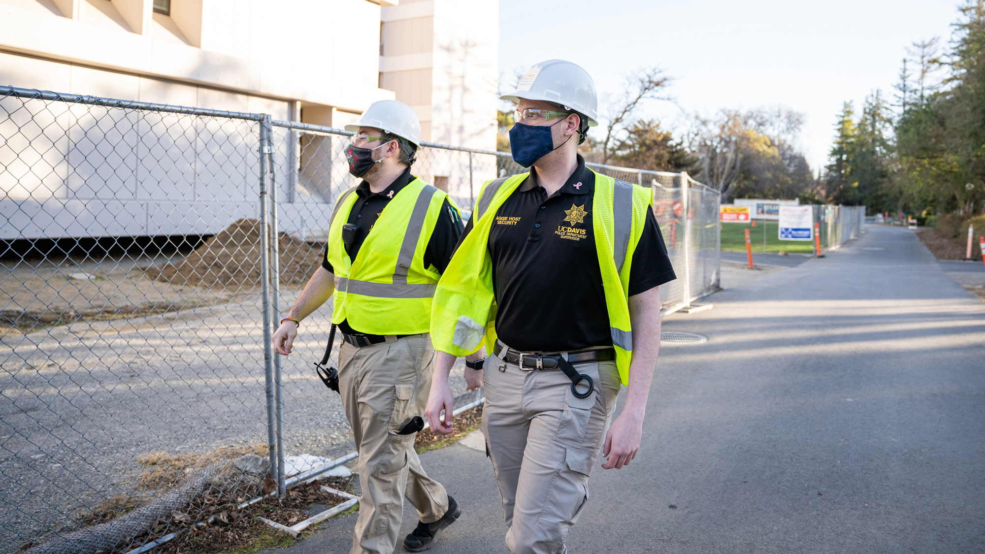 Aggie Hosts monitoring a construction site for compliance with public health guidelines