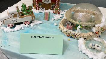Scene including a gingerbread "3rd & A" building, a gingerbread truck, and a couple sugar work domes