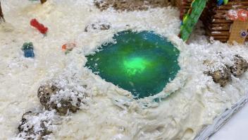 Frozen pond at the gingerbread ski lodge scene