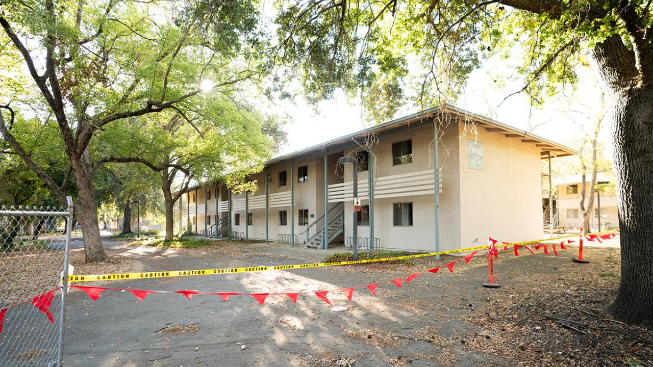Image of Solano Park Housing complex with yellow, do-not-cross tape in front.