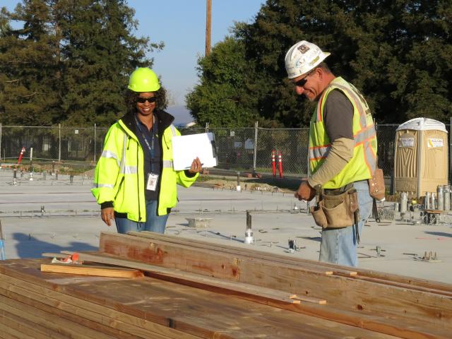 Two people at a construction site