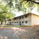 Image of Solano Park Housing complex with yellow, do-not-cross tape in front.
