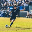 Two soccer players playing on a field at UC Davis