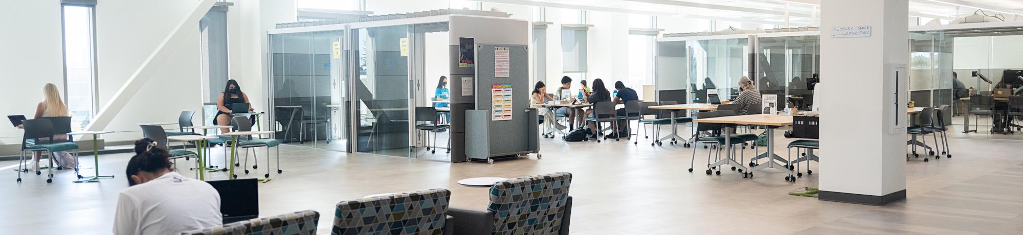 Students working on the fourth floor of the Teaching Learning Complex